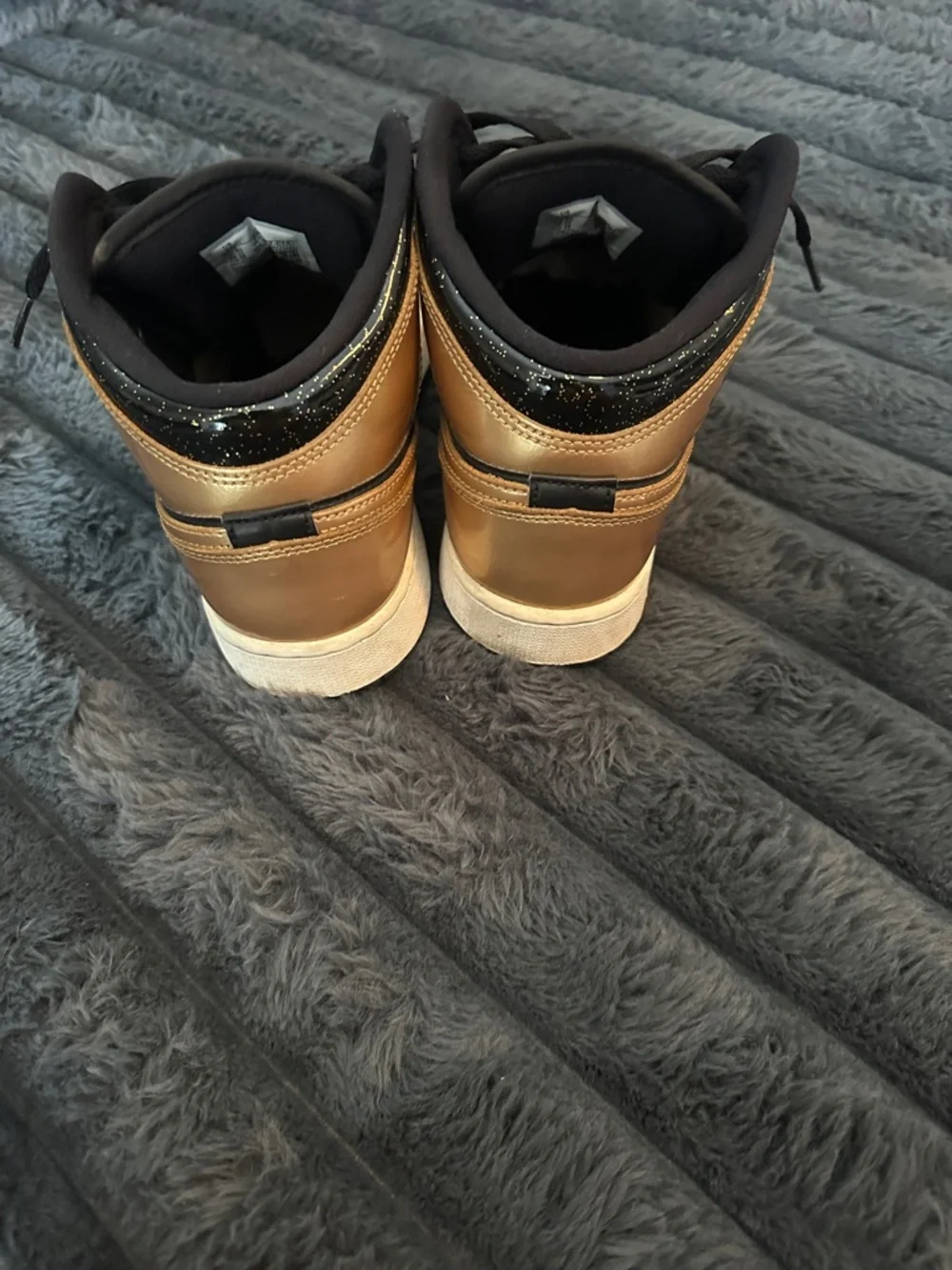 Nike Mid-Top Sneakers in Black and Metallic Gold